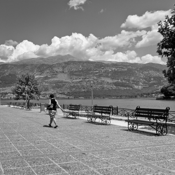 woman walking by Ioannina lake, Greece